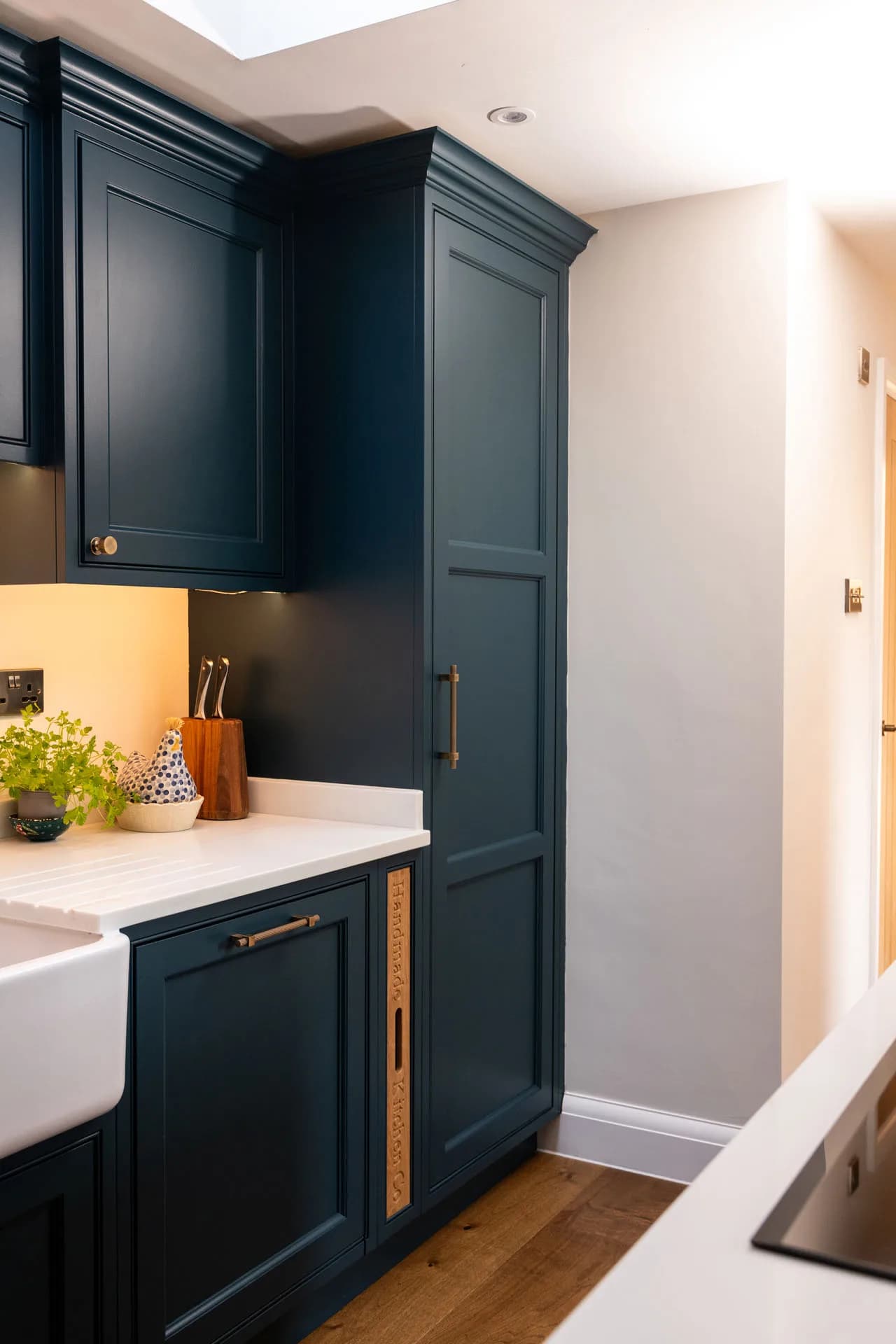 Hand-painted shaker cabinetry with brass hardware